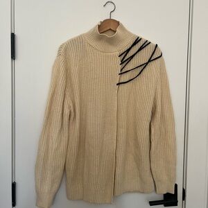 Elegant Cream Sweater with Black Accents